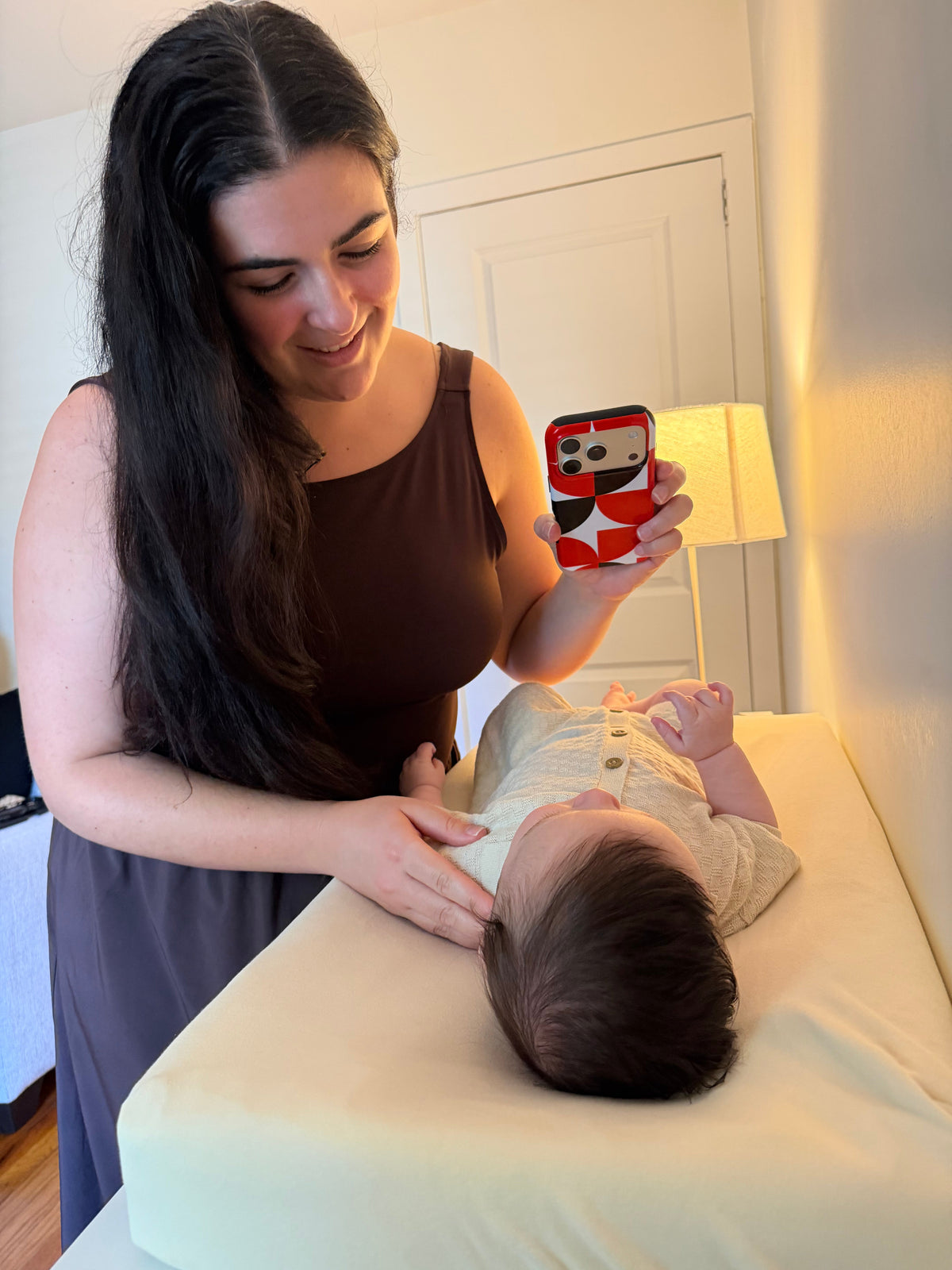 Baby looking at a Gabo Baby high-contrast phone case